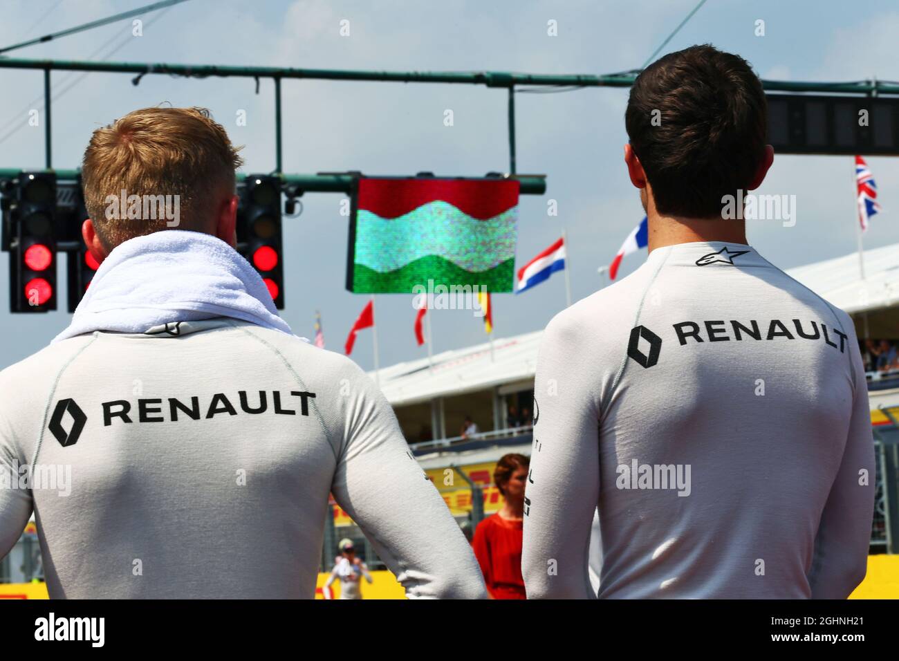 (L to R): Kevin Magnussen (DEN) Renault Sport F1 Team and Jolyon Palmer (GBR) Renault Sport F1 Team as the grid observes the national anthem.  24.07.2016. Formula 1 World Championship, Rd 11, Hungarian Grand Prix, Budapest, Hungary, Race Day.  Photo credit should read: XPB/Press Association Images. Stock Photo