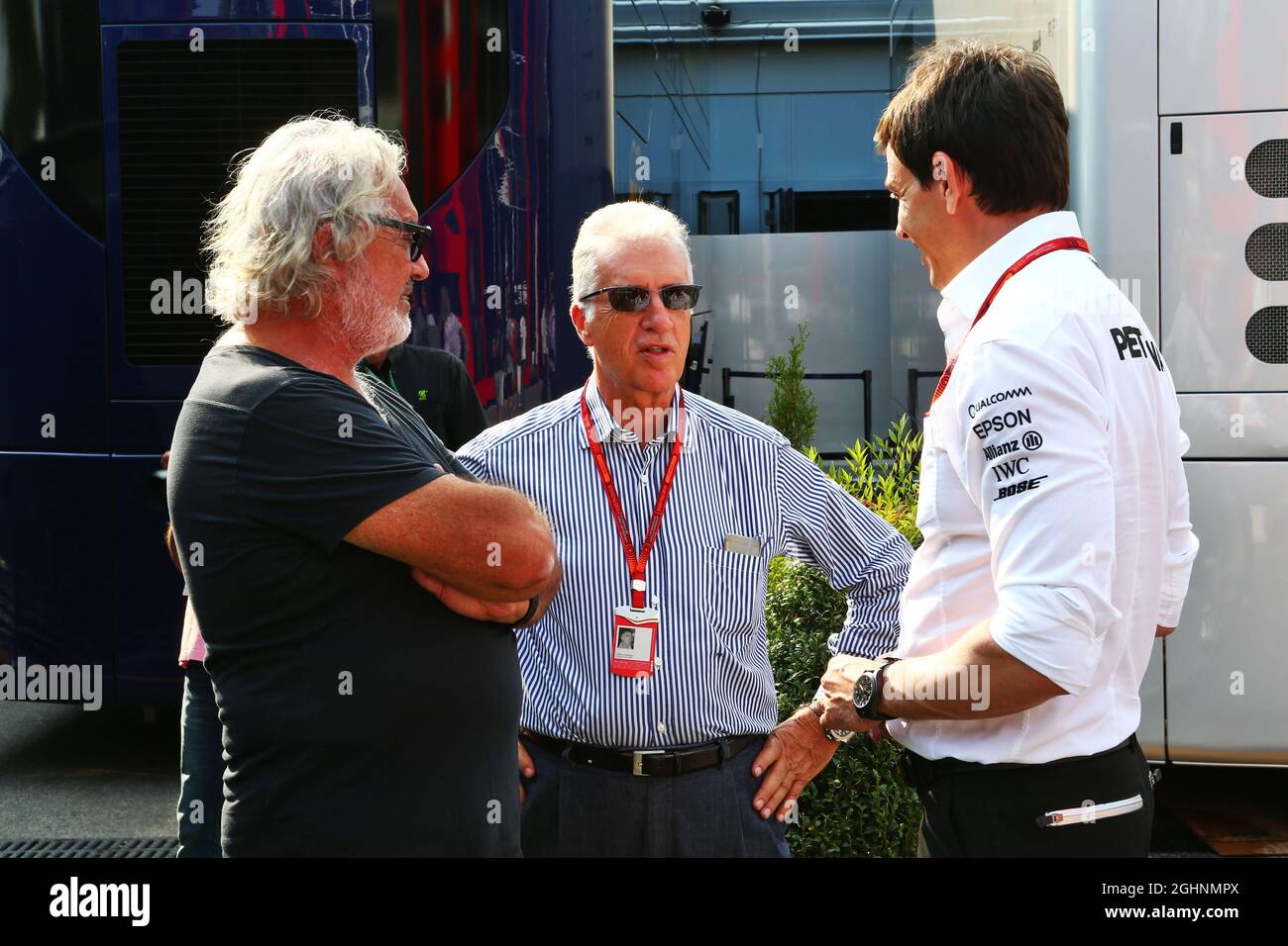 (L to R): Flavio Briatore (ITA) with Piero Ferrari (ITA) Ferrari Vice-President and Toto Wolff (GER) Mercedes AMG F1 Shareholder and Executive Director.  03.09.2016. Formula 1 World Championship, Rd 14, Italian Grand Prix, Monza, Italy, Qualifying Day.  Photo credit should read: XPB/Press Association Images. Stock Photo