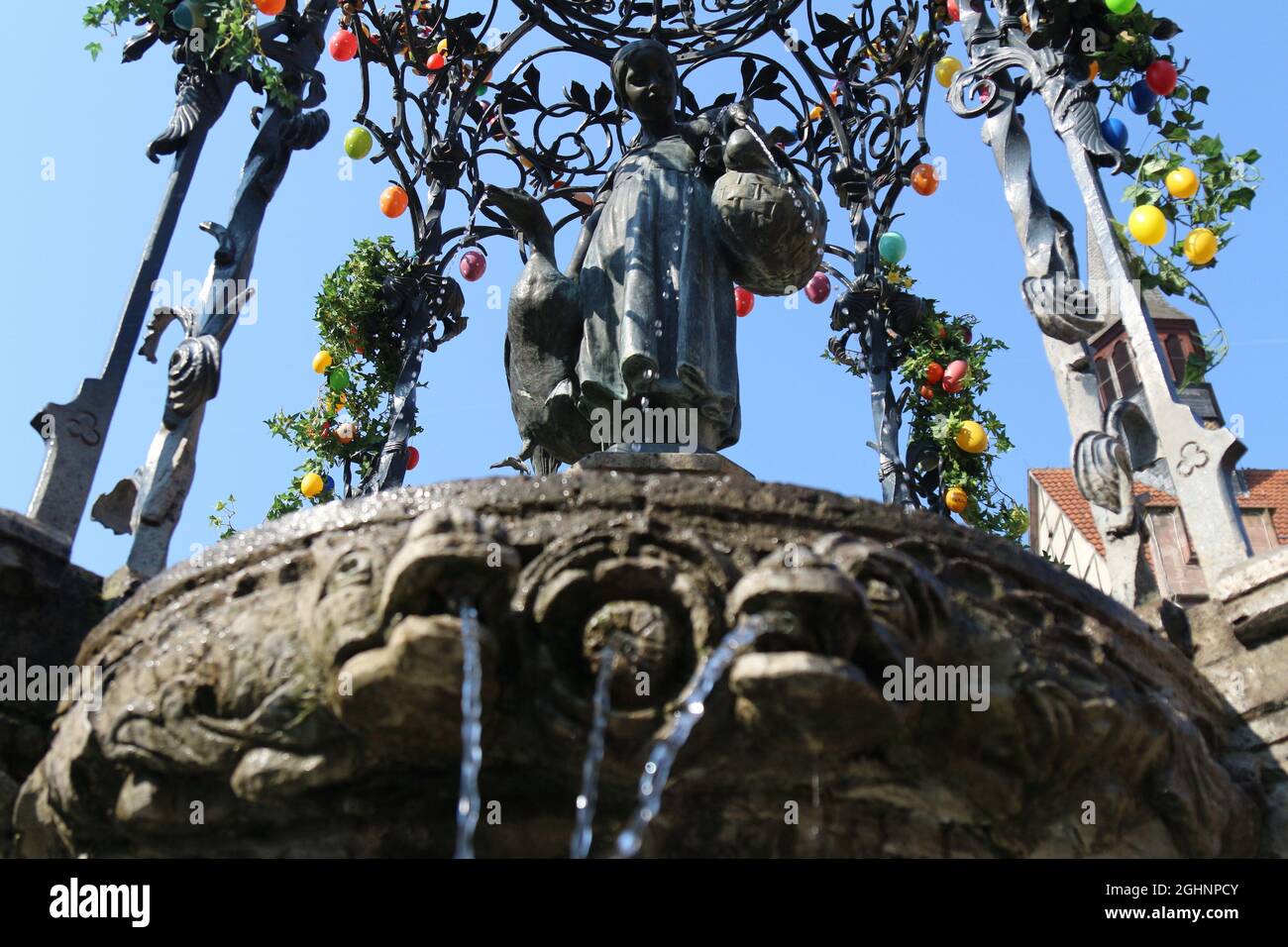 GOETTINGEN, GERMANY - Mar 20, 2015: A low angle shot of the Gaenseliesel or Goose Girl fountain at Goettingen square in Germany. Stock Photo