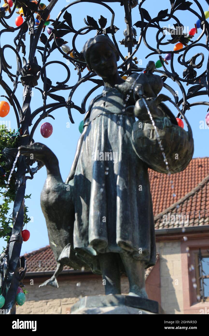 GOETTINGEN, GERMANY - Mar 20, 2015: A vertical shot of the Gaenseliesel or Goose Girl fountain at Goettingen square in Germany. Stock Photo