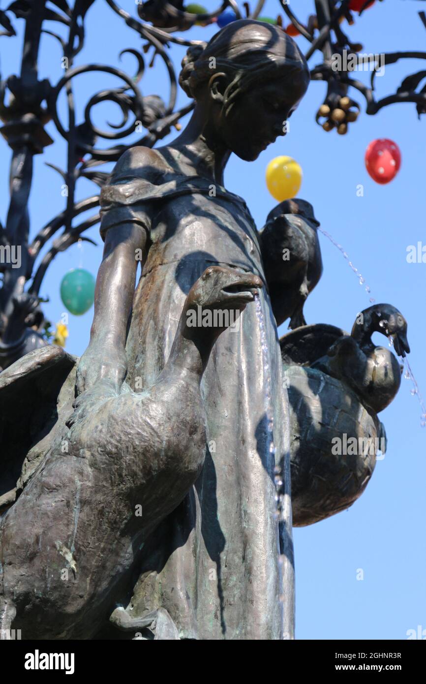 GOETTINGEN, GERMANY - Mar 20, 2015: A vertical shot of the Gaenseliesel or Goose Girl fountain at Goettingen square in Germany. Stock Photo