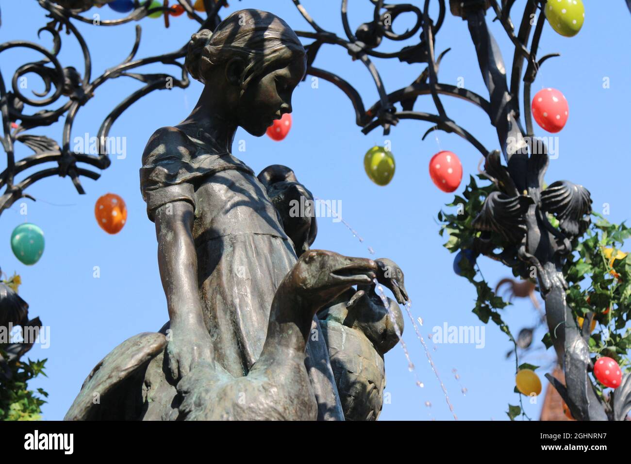 GOETTINGEN, GERMANY - Mar 20, 2015: A low angle shot of the Gaenseliesel or Goose Girl fountain at Goettingen square in Germany Stock Photo