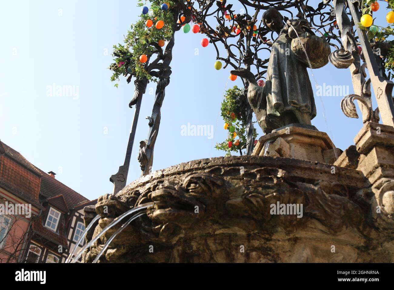 GOETTINGEN, GERMANY - Mar 20, 2015: A low angle shot of the Gaenseliesel or Goose Girl fountain at Goettingen square in Germany Stock Photo