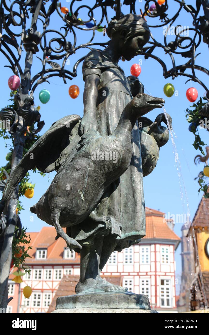 GOETTINGEN, GERMANY - Mar 20, 2015: A vertical shot of the Gaenseliesel or Goose Girl fountain at Goettingen square in Germany Stock Photo