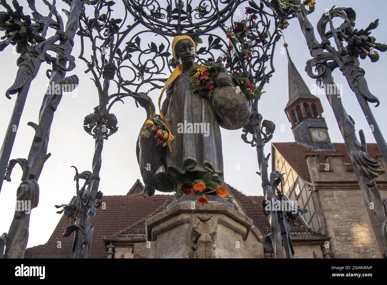 GOETTINGEN, GERMANY - Mar 13, 2015: A low angle shot of the Gaenseliesel or Goose Girl fountain at Goettingen square in Germany Stock Photo