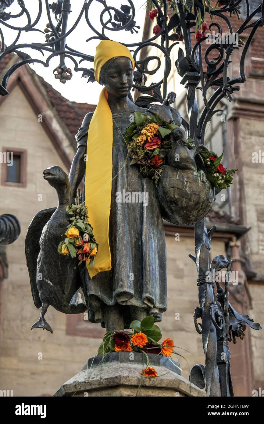 GOETTINGEN, GERMANY - Mar 13, 2015: A vertical shot of the Gaenseliesel or Goose Girl fountain at Goettingen square in Germany Stock Photo