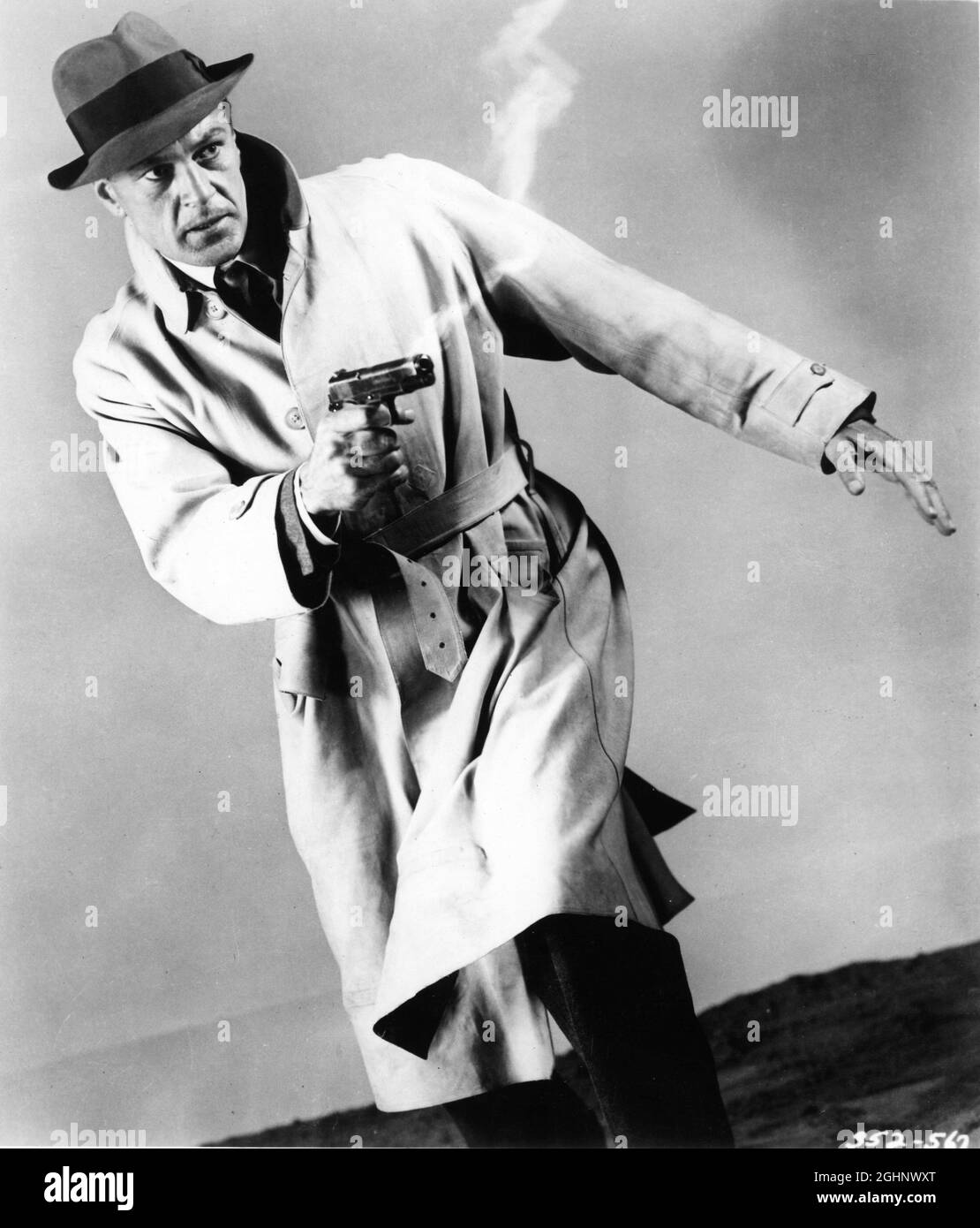 GARY COOPER publicity pose in CLOAK AND DAGGER 1946 director FRITZ LANG