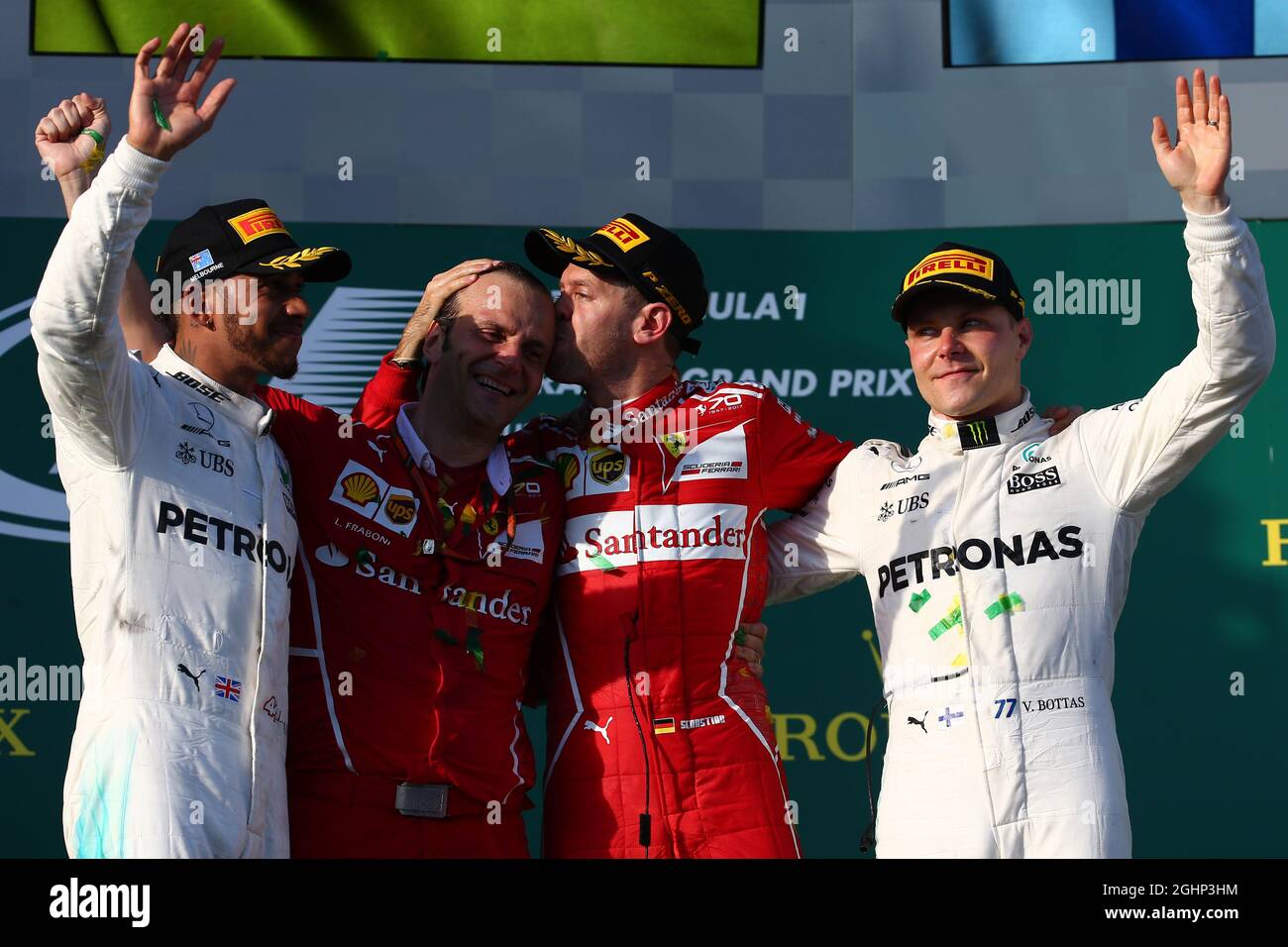 The podium (L to R): Lewis Hamilton (GBR) Mercedes AMG F1, second; Luigi Fraboni (ITA) Ferrari Head of Engine Trackside Operations; Sebastian Vettel (GER) Ferrari, race winner; Valtteri Bottas (FIN) Mercedes AMG F1, third.  26.03.2017. Formula 1 World Championship, Rd 1, Australian Grand Prix, Albert Park, Melbourne, Australia, Race Day.  Photo credit should read: XPB/Press Association Images. Stock Photo