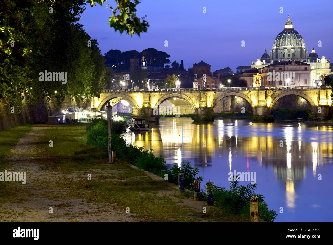 St Peter Dome and Tiber river at dusk Stock Photo