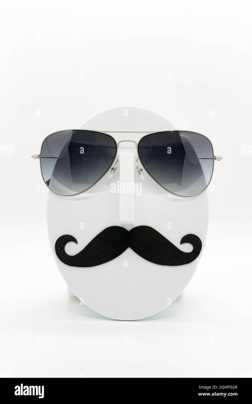 Men's fashion mannequin wearing fashionable sunglasses on white background. Stock Photo