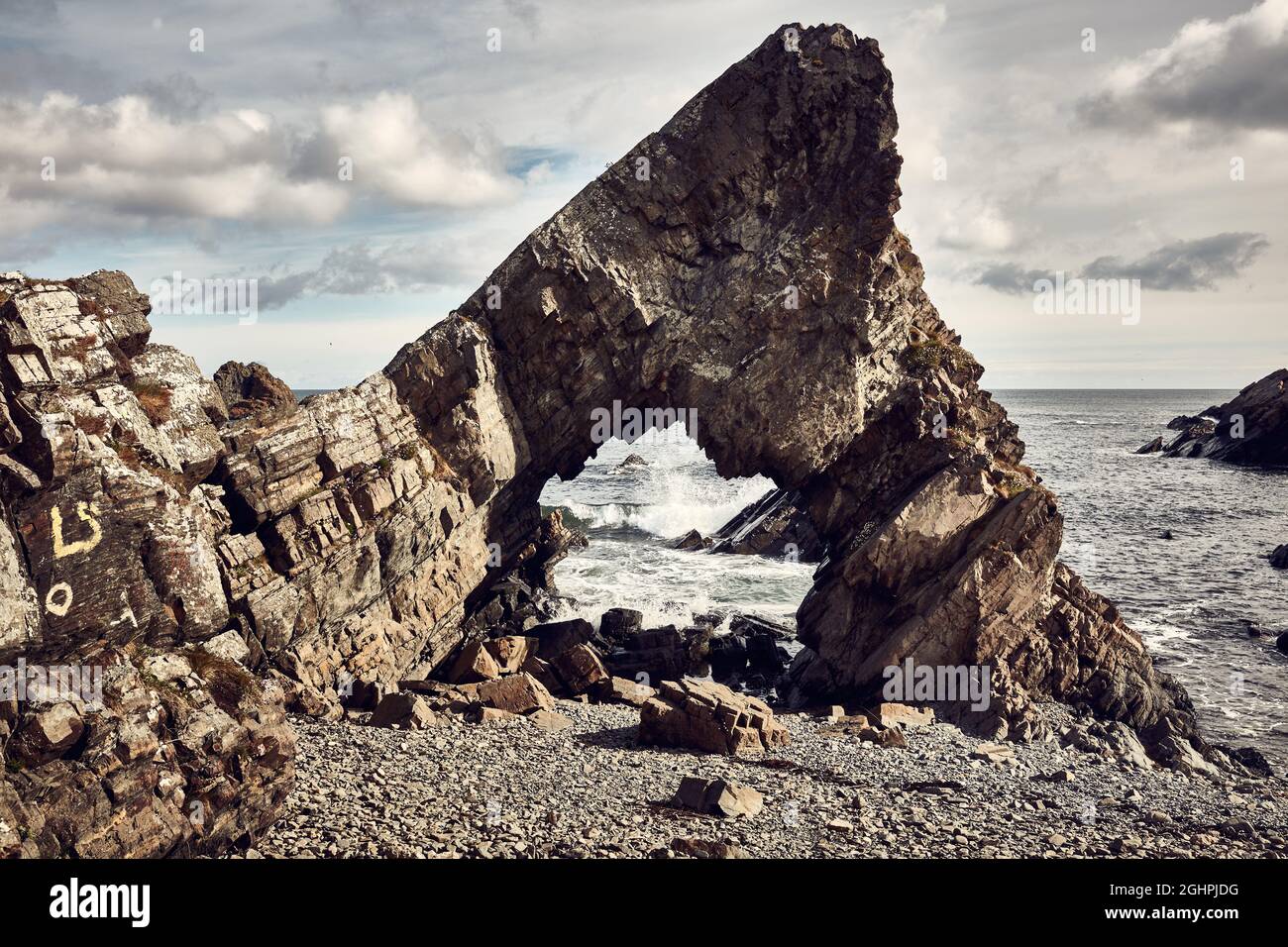 Rock Arch on the coast Stock Photo