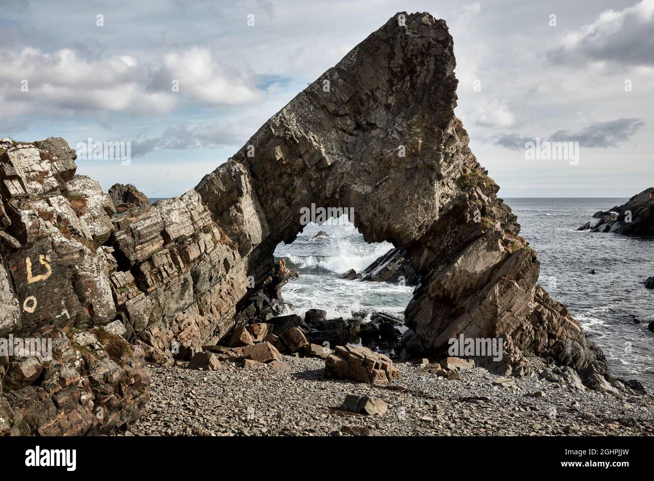 Rock Arch on the coast Stock Photo