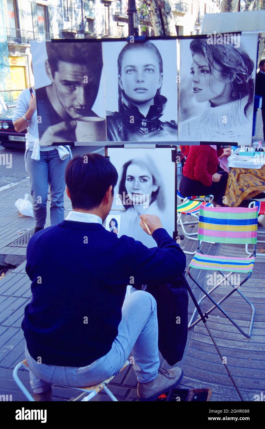 Street artist drawing a portrait at the Rambla. Barcelona, Spain. Stock Photo