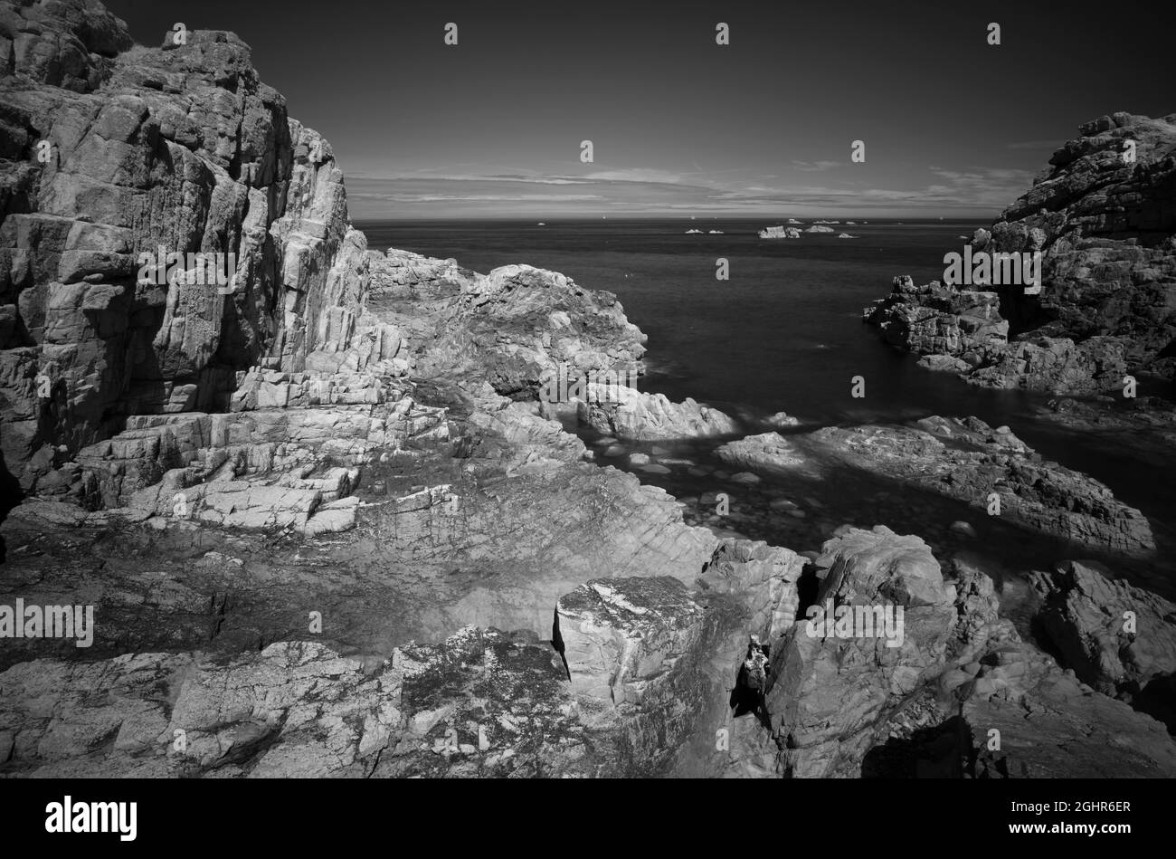 Infrared image, rocky coast along the Sentier des douaniers, customs trail GR 34, Plougrescant, Cote de Granit Rose, Cotes d'Armor, Brittany, France Stock Photo
