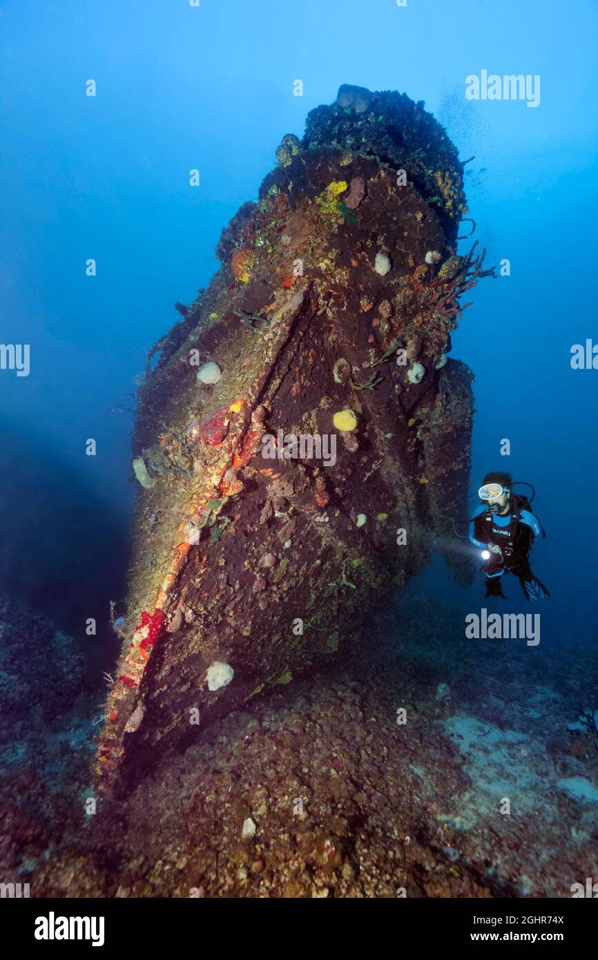 Divers at the bow of tugboat, wreck, shipwreck, Virgen de Altagracia, Caribbean Sea near Playa St. Lucia, Camagueey Province, Caribbean, Cuba Stock Photo
