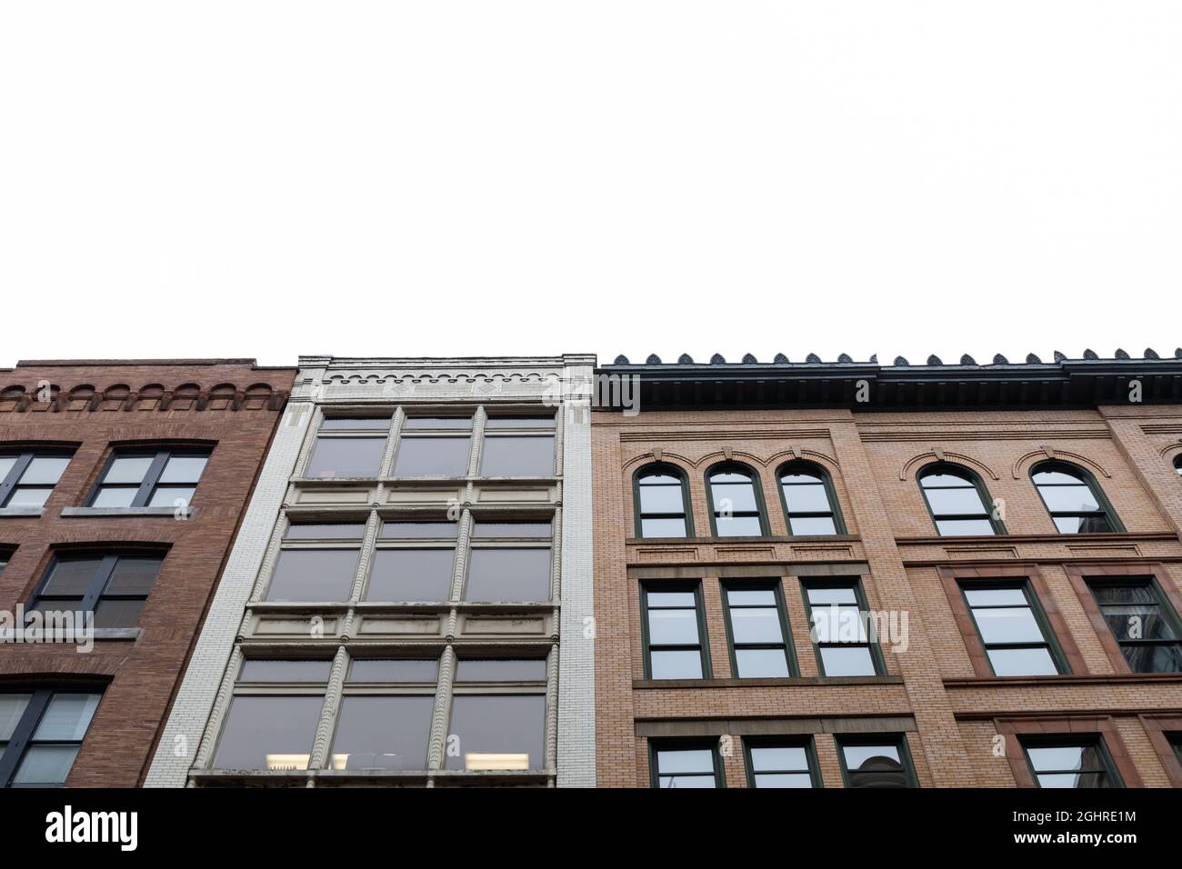 View looking up of old brick office buildings, rehabilitated with new