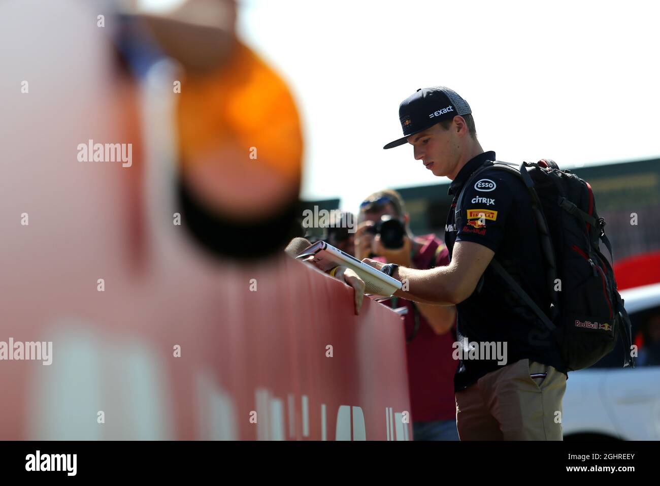Max Verstappen (NLD) Red Bull Racing signs autographs for the fans. 08. ...