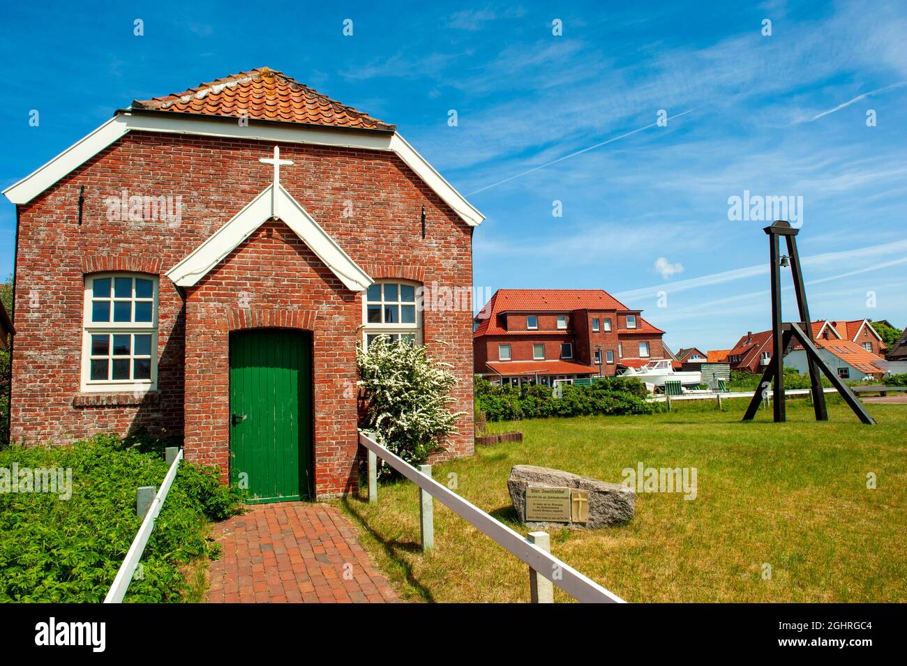 Old protestant island church with external church bell, Baltrum Island, East Frisia, Lower Saxony, North Sea, Germany Stock Photo