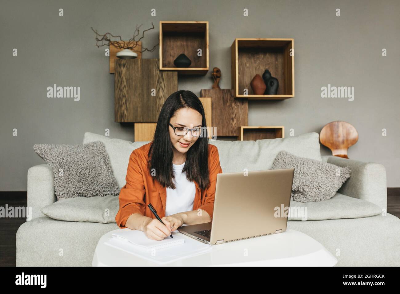The student studies at home, programs or works as a freelancer.  Stock Photo