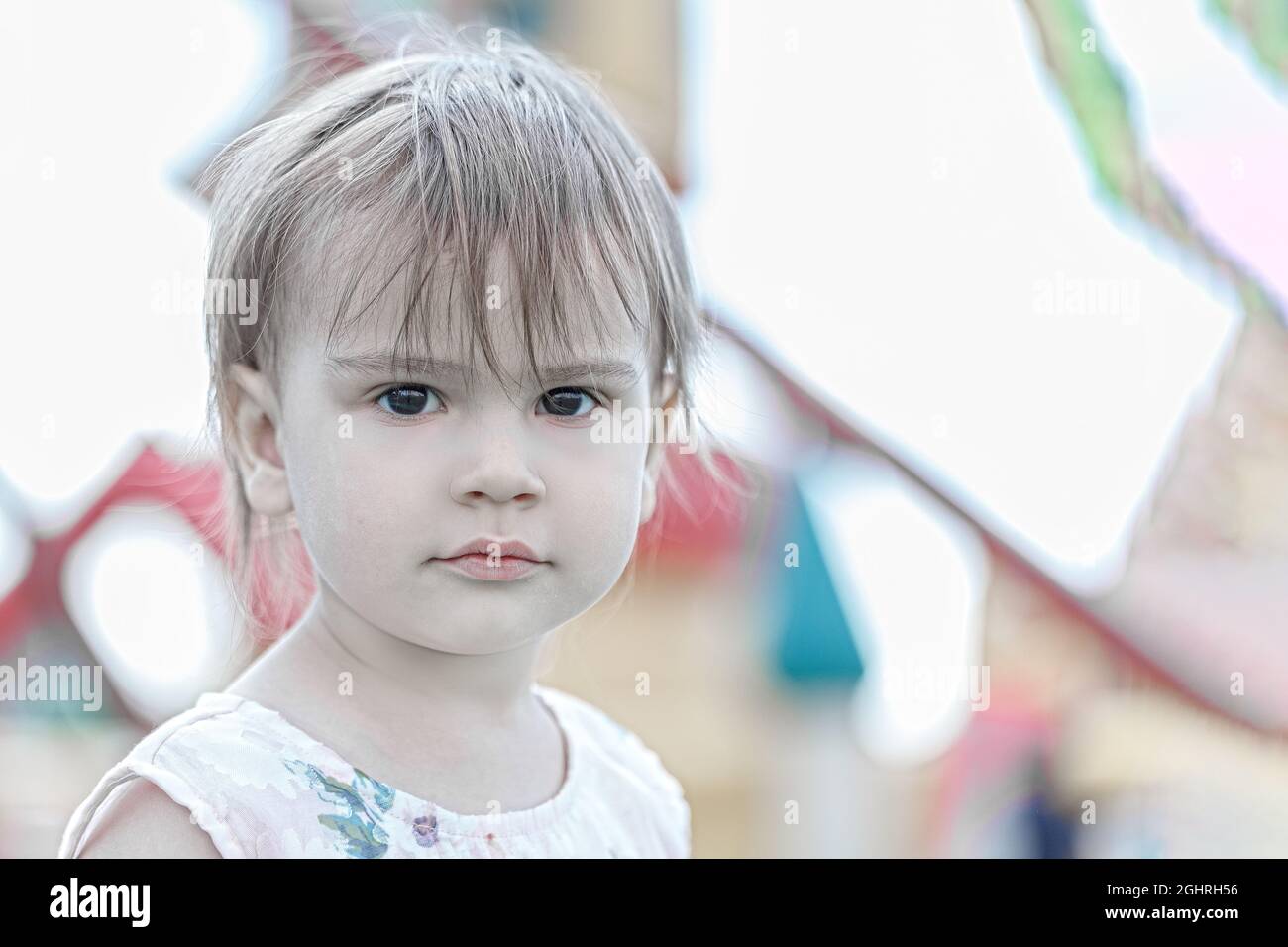 Portrait of a two year old child in the summer amusement park Stock Photo Alamy