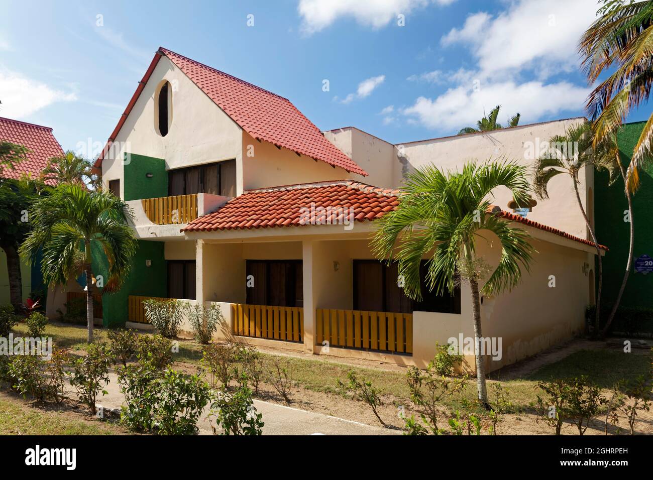 Bungalow, garden area, Coconut palm (Cocos nucifera), Hotel Brisas, Playa St. Lucia, Camagueey Province, Caribbean, Cuba Stock Photo