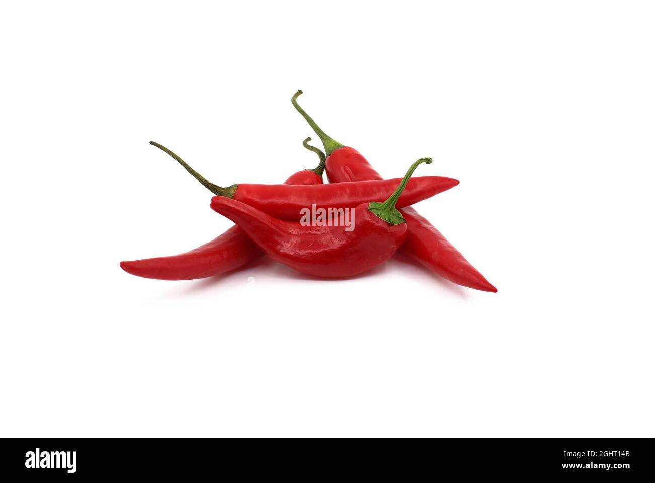 Fresh red chili peppers isolated on a white background Stock Photo - Alamy