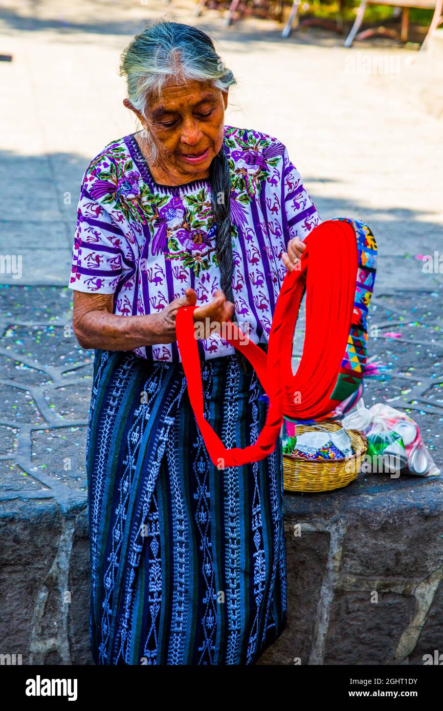 Demonstration of how to tie a typical headdress of the Tzutuhil woman, the Tocoyal, Santiago Atitlan, Lake Atitlan, Santiago Atitlan, Guatemala Stock Photo