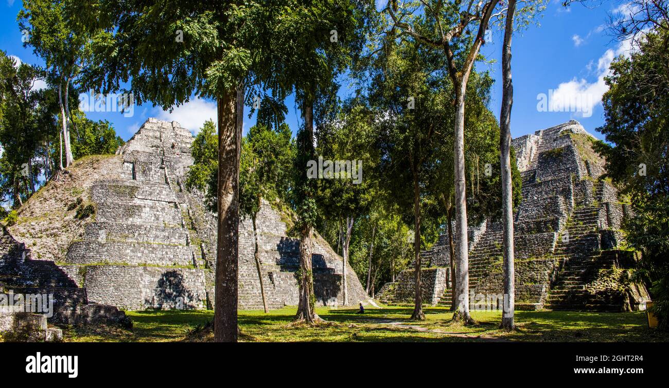 Plaza E of the North Acropolis with two temples of the Triadico, Yaxha, third largest ruined city of the Maya, Yaxha, Guatemala Stock Photo