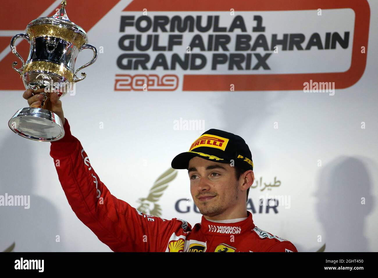 Race winner Charles Leclerc celebrate on the podium with the trophy, Formula  1 photos