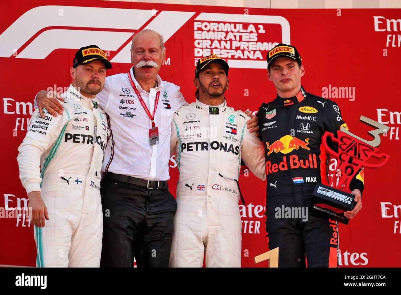 The podium (L to R): Valtteri Bottas (FIN) Mercedes AMG F1, second; Dr. Dieter Zetsche (GER) Daimler AG CEO; Lewis Hamilton (GBR) Mercedes AMG F1, race winner; Max Verstappen (NLD) Red Bull Racing, third..  12.05.2019. Formula 1 World Championship, Rd 5, Spanish Grand Prix, Barcelona, Spain, Race Day.  Photo credit should read: XPB/Press Association Images. Stock Photo