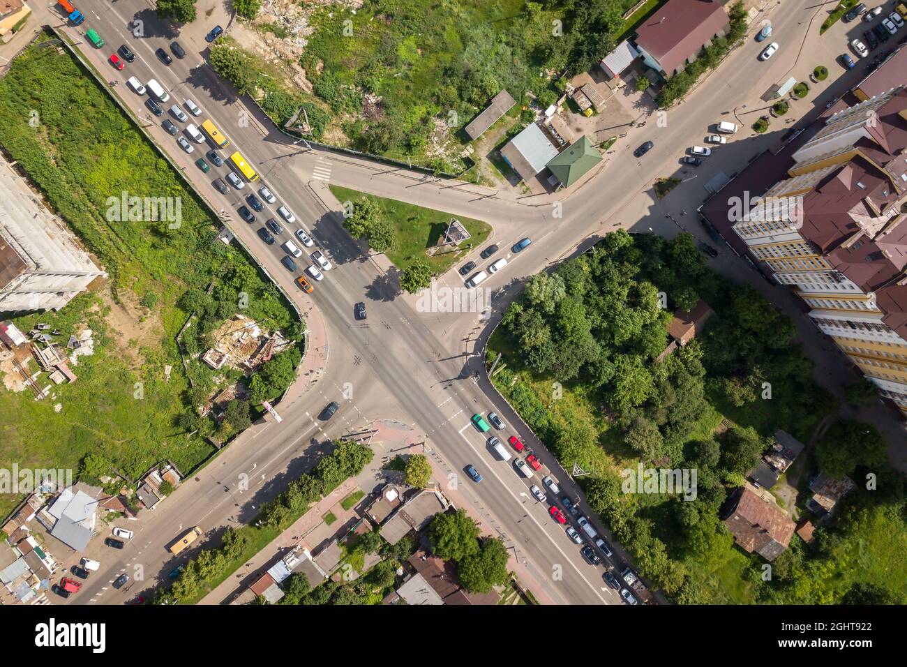 Top down aerial view of busy street intersection with moving cars ...