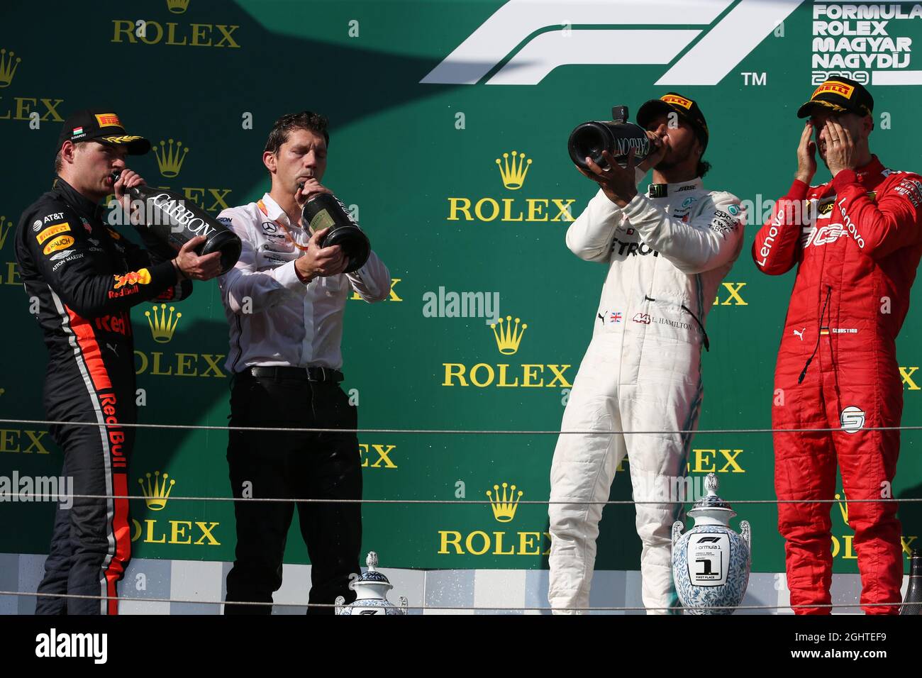 The podium (L to R): Max Verstappen (NLD) Red Bull Racing, second; James Vowles (GBR) Mercedes AMG F1 Chief Strategist; Lewis Hamilton (GBR) Mercedes AMG F1, race winner; Sebastian Vettel (GER) Ferrari, third.  04.08.2019. Formula 1 World Championship, Rd 12, Hungarian Grand Prix, Budapest, Hungary, Race Day.  Photo credit should read: XPB/Press Association Images. Stock Photo