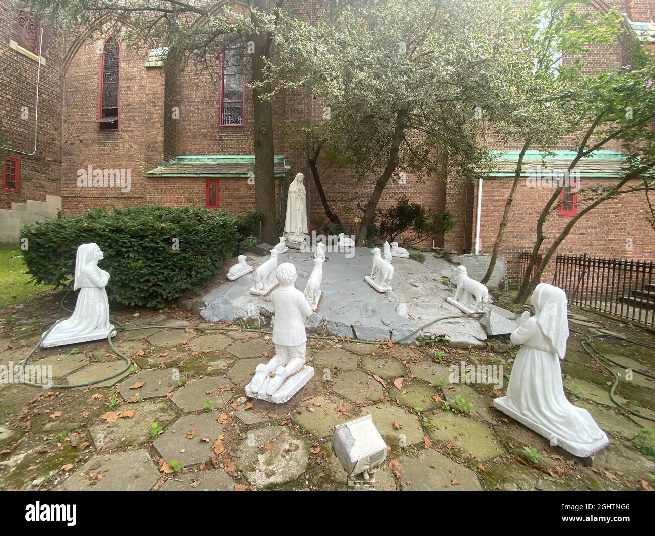 Shrine to "Our Lady of Fatima Apparition" the 1917 sighting by 3 children in Portugal of the Virgin Mary who spoke to them every week for a month as the story goes. Catholic Church, Brooklyn, New York. Stock Photo