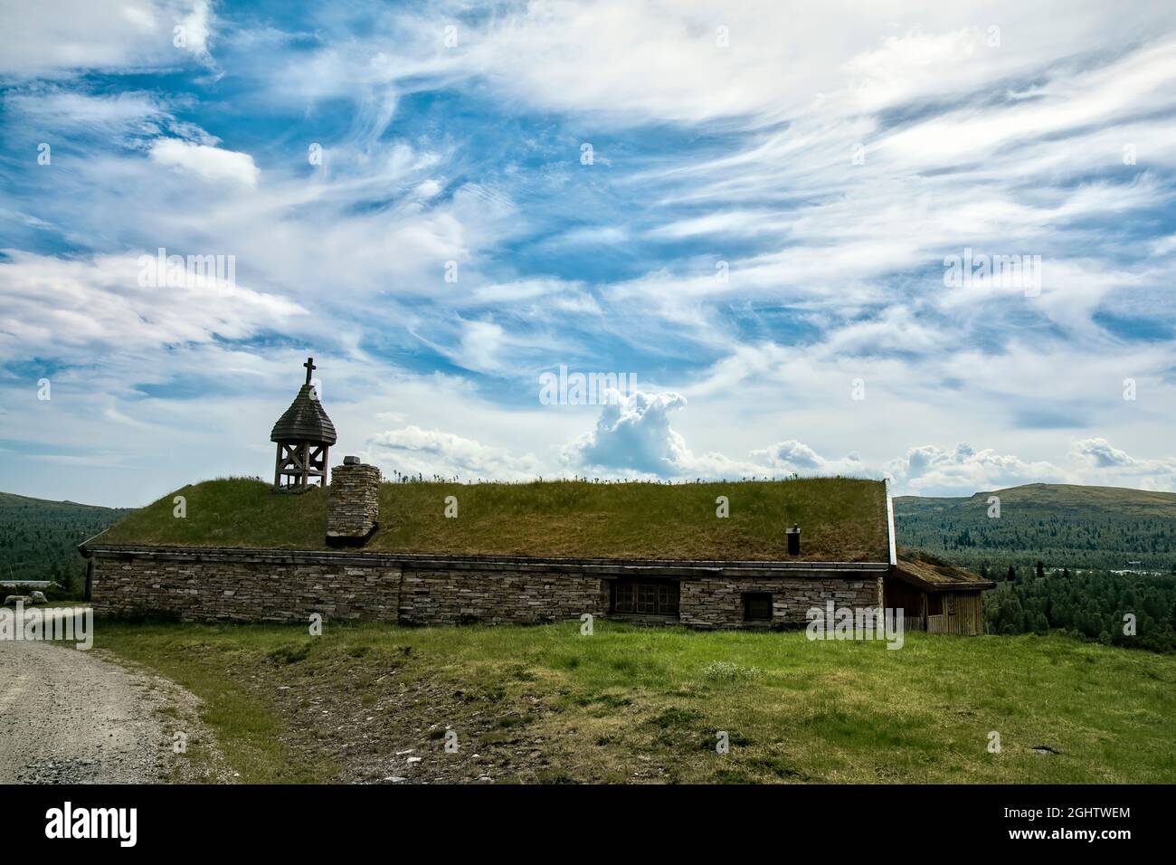 Old church with grass roof in the mountains in Norway Stock Photo