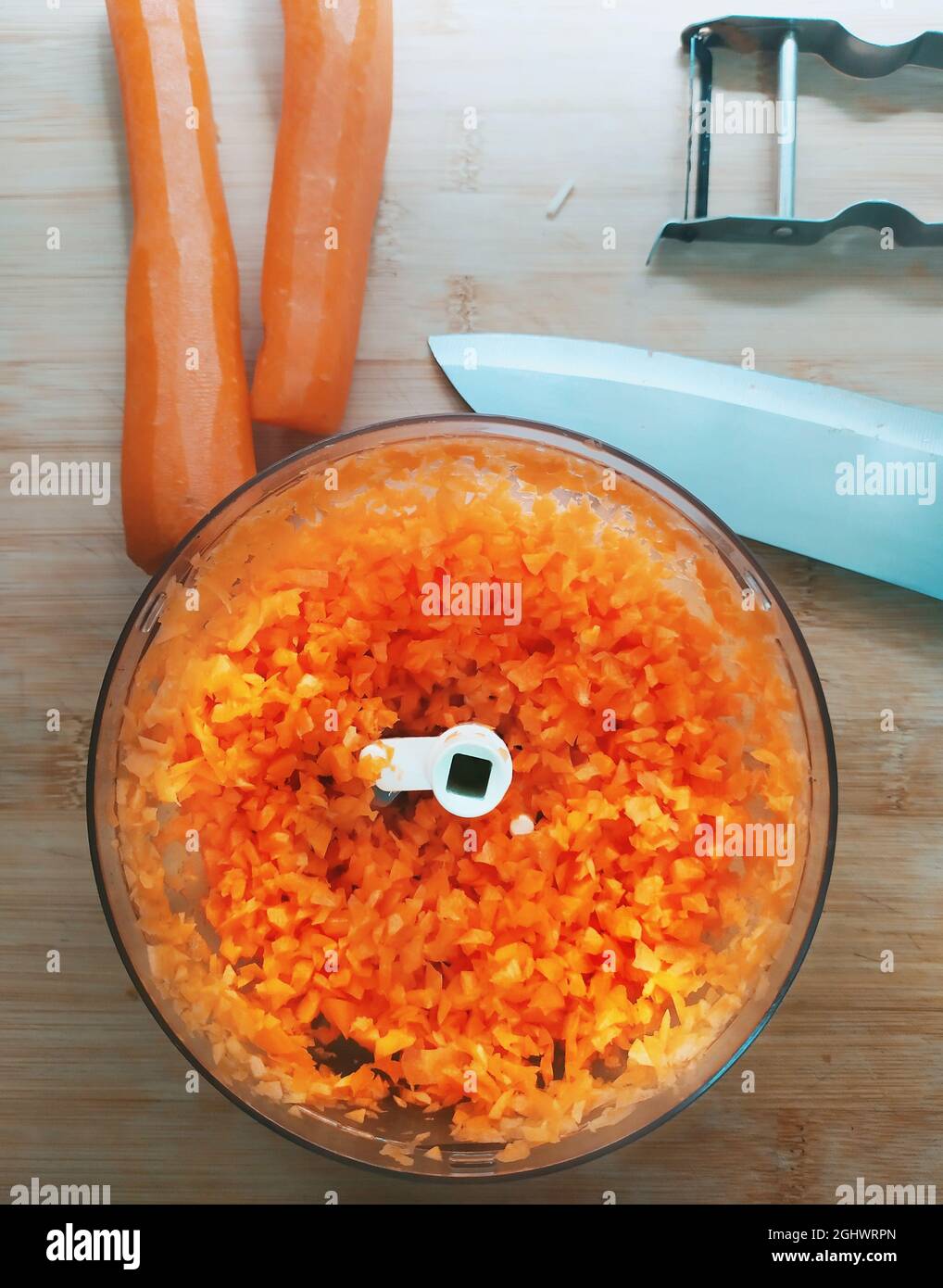 Carrots being diced in a blender Stock Photo Alamy
