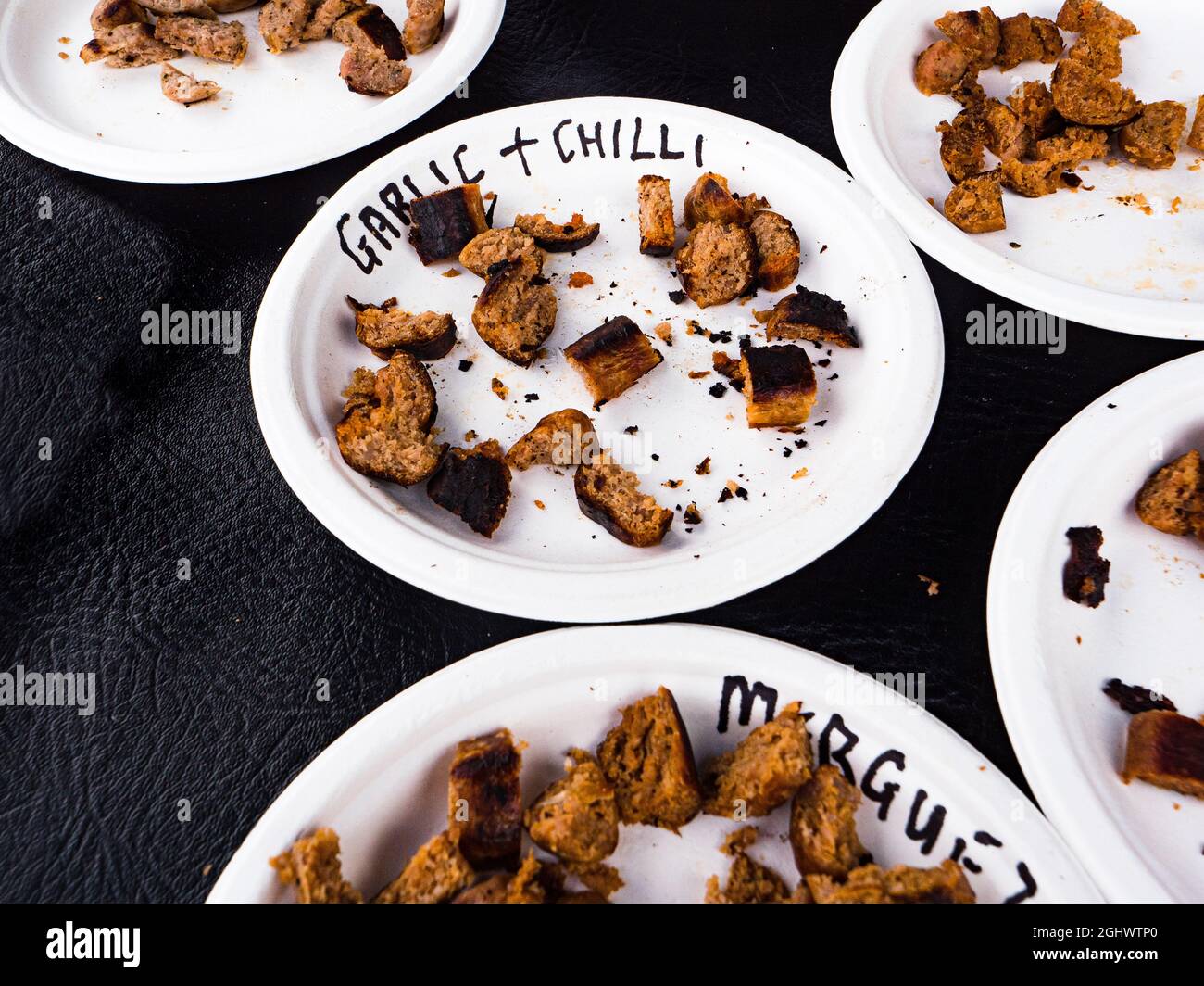 Samples of hot chilli infused sausage at the Waddesdon Manor Chilli festival. Stock Photo