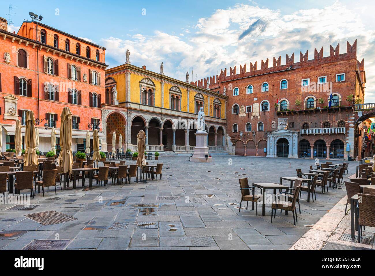 Verona old town square Piazza dei Signori with Dante statue and street cafe with nobody. Veneto, Italy. Tourist destination Stock Photo