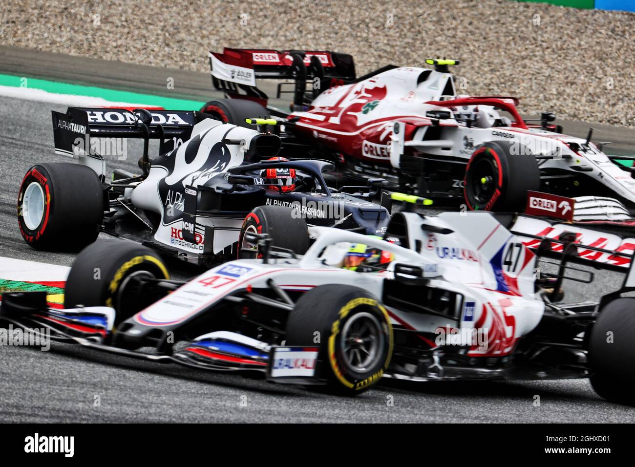 Pierre Gasly (FRA) AlphaTauri AT02 sandwiched inbetween Mick Schumacher  (GER) Haas VF-21 and Callum Ilott (GBR) Alfa Romeo Racing C41 Reserve  Driver. 02.07.2021. Formula 1 World Championship, Rd 9, Austrian Grand Prix,