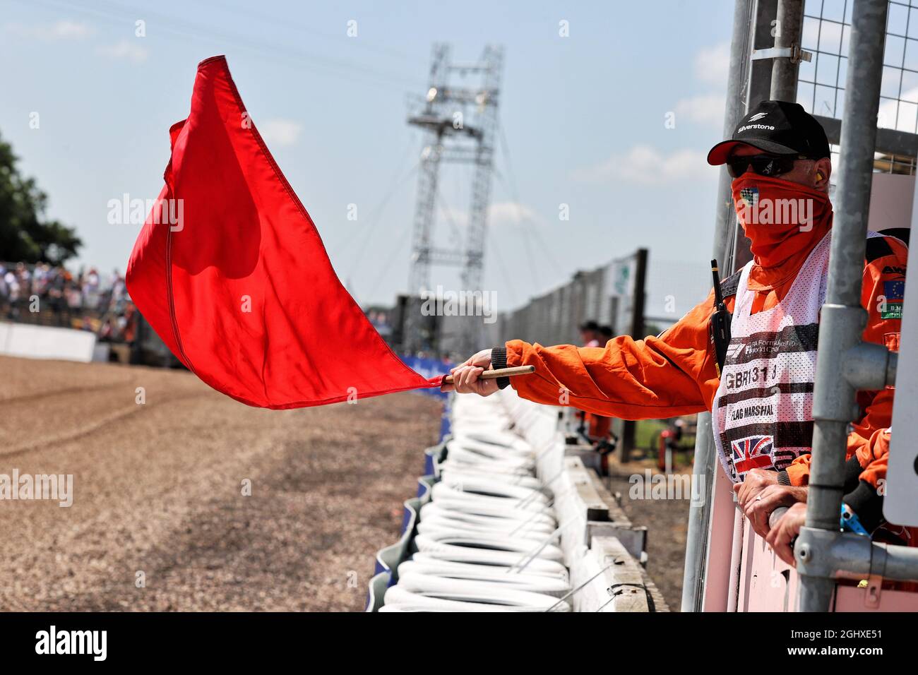 Circuit atmosphere marshal waves a red flag. 16.07.2021. Formula 1