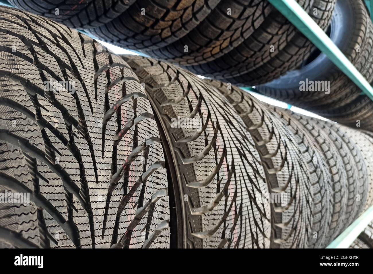 Many black rubber car tires on store shelf for sale Stock Photo Alamy