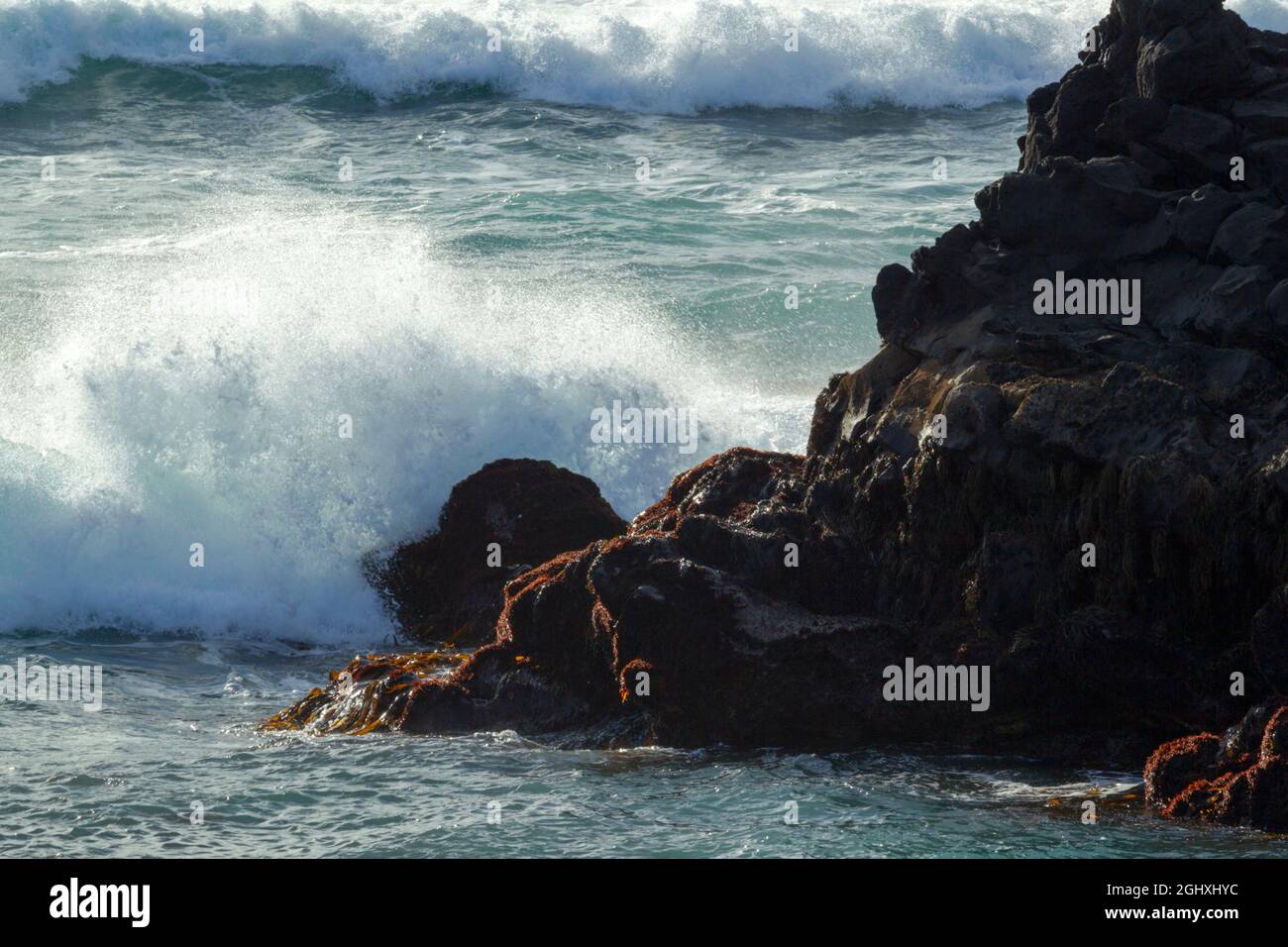 Energetic waves crashing against volcanic rocks at  Londranagar on the Snæfellsnesnes peninsula in the Western part of Iceland Stock Photo