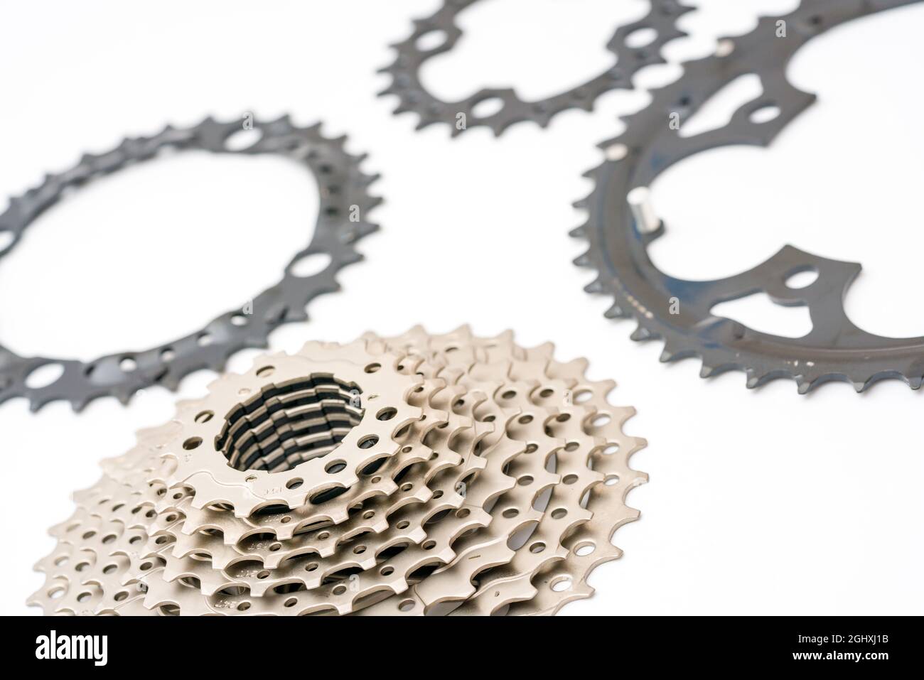 Gears, sprockets and chain of a mountain sports bike on a white
