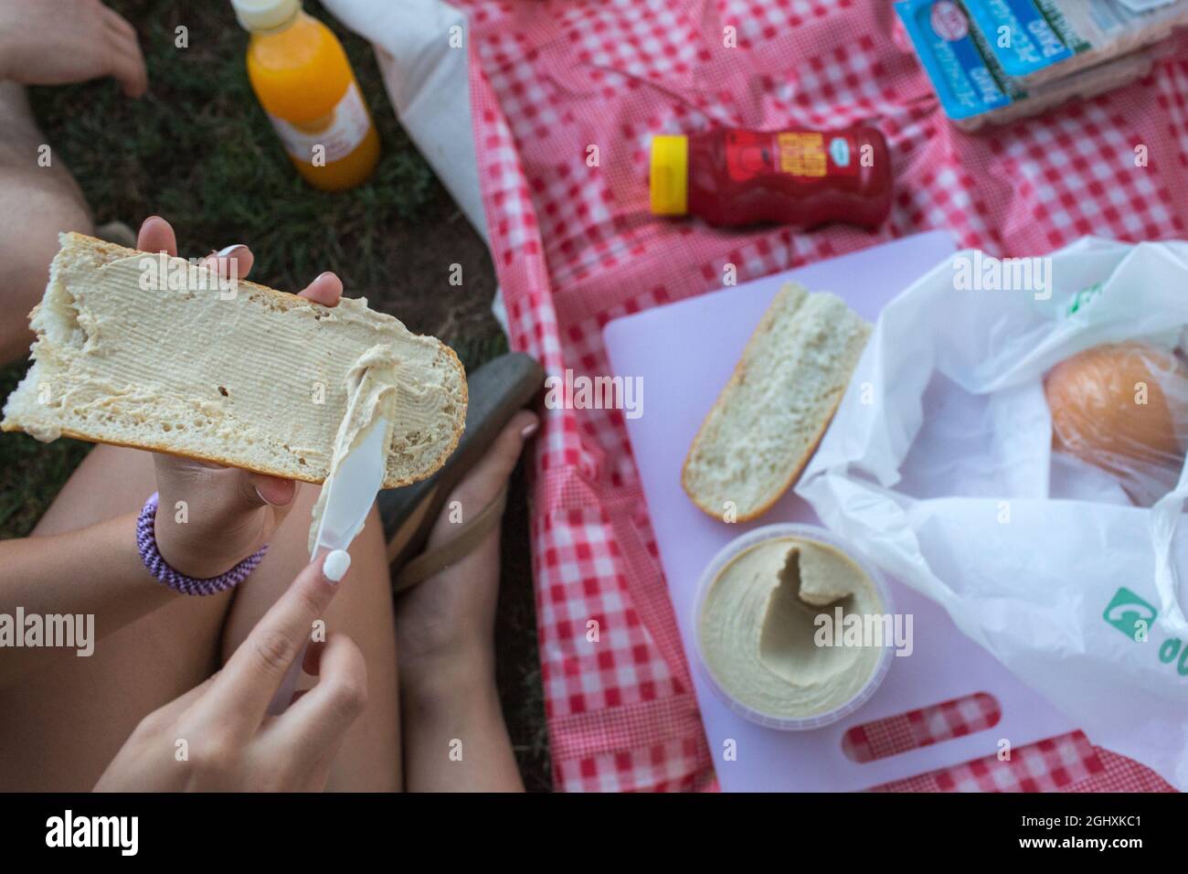 Barcelona, Spain, July 2018. People enjoy a picnic in a park in