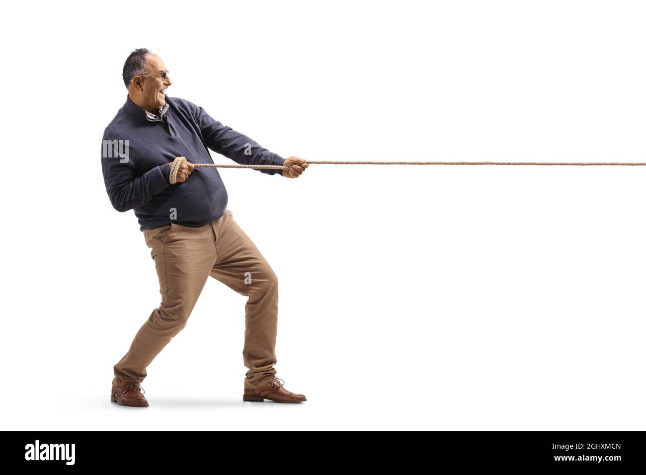 Man pulling rope tug war hi-res stock photography and images - Alamy