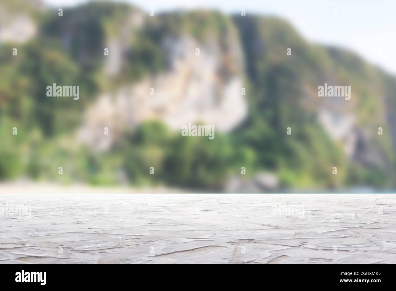 textured white surface on blurry mountains background Stock Photo
