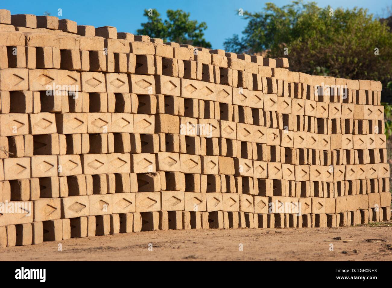 Hand made bricks from wet clay and mud are kept for drying before the burning process