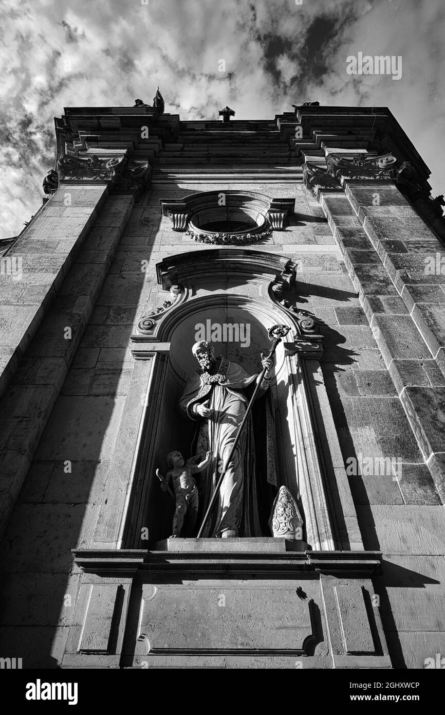 Vertical low angle shot of a church in grayscale with the beautiful ...