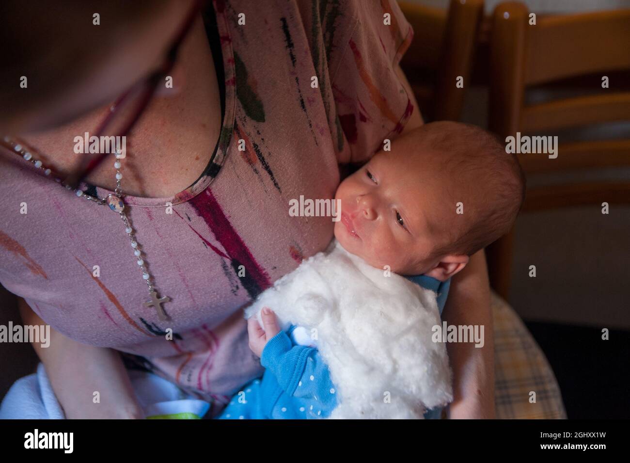 White Caucasian mother holding her newborn baby Stock Photo