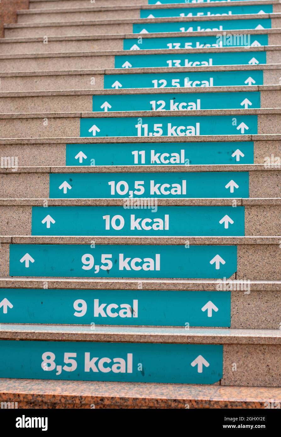 Calories count at Staircase in shopping mall. Each step half calories burned. Exercises awareness concept. Stock Photo