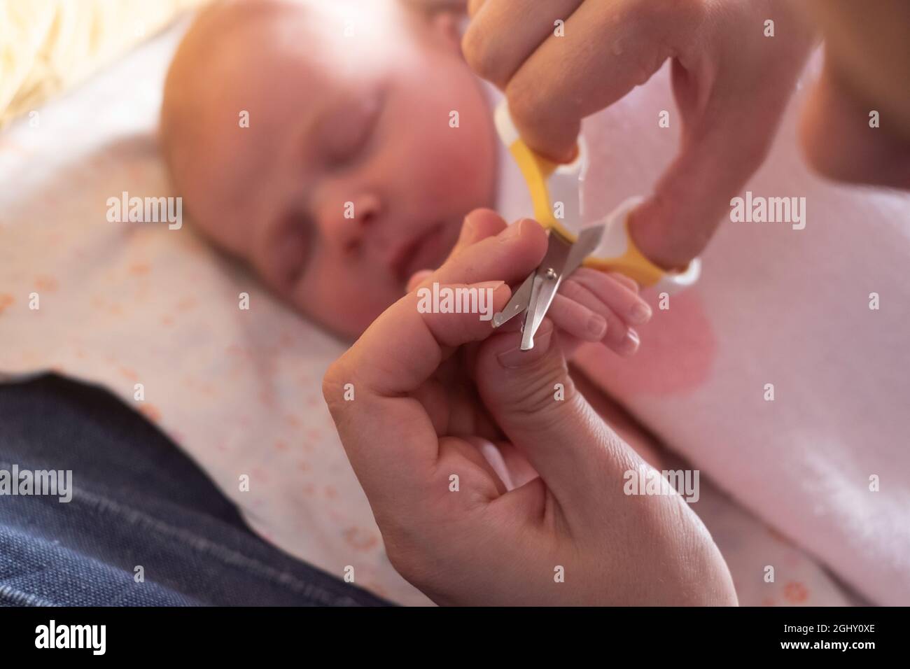 Mother cutting baby nails. Newborn hygiene concept Stock Photo Alamy